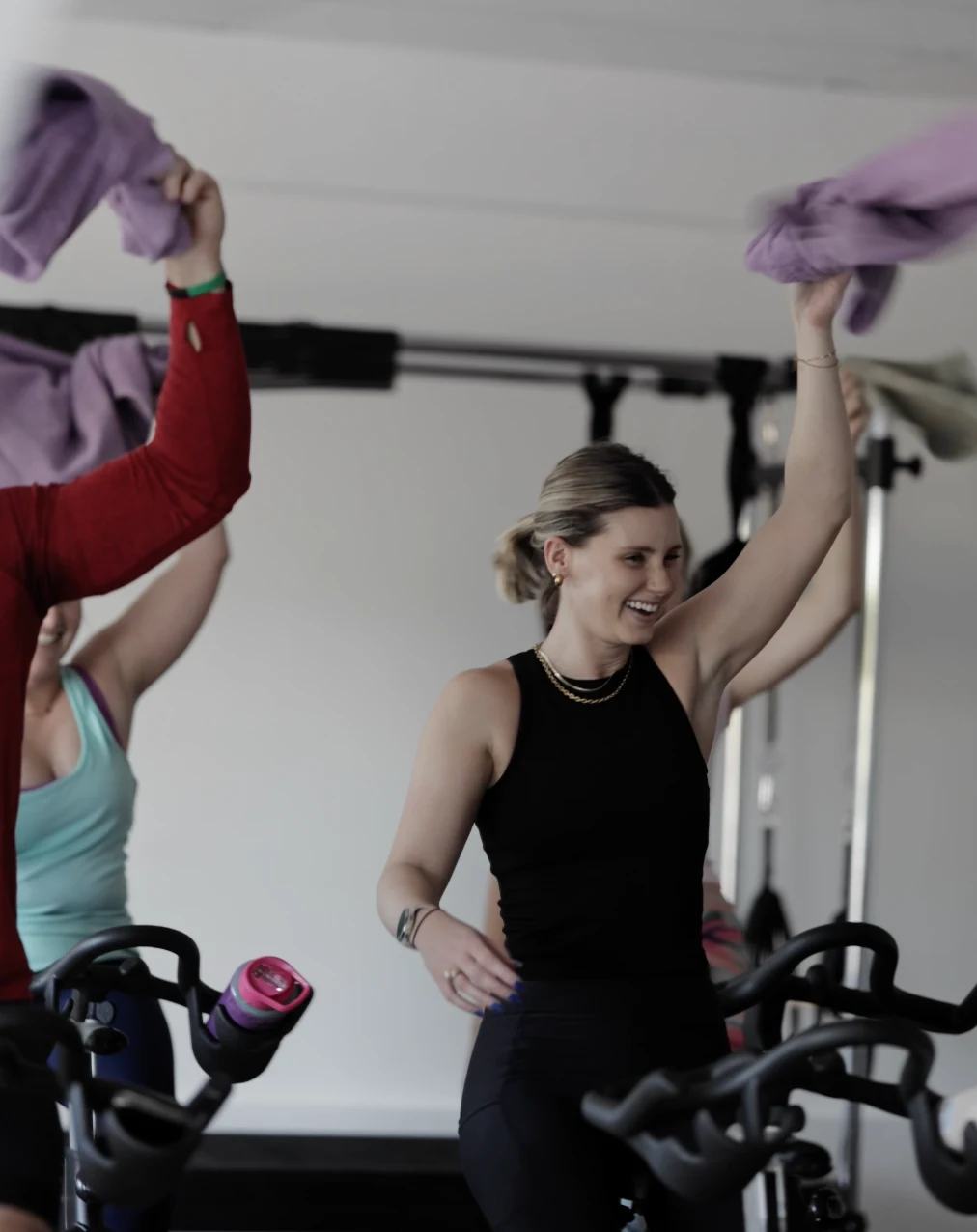 Cleats Cycle riders celebrating together during class